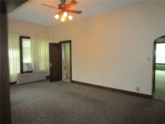 506 W 5th St, Pana, IL 62557 - unfurnished room featuring radiator heating unit, carpet, ceiling fan, and baseboards