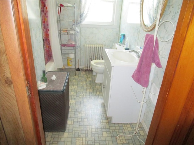 506 W 5th St, Pana, IL 62557 - full bath with radiator heating unit, vanity, toilet, a shower with curtain, and a tub to relax in