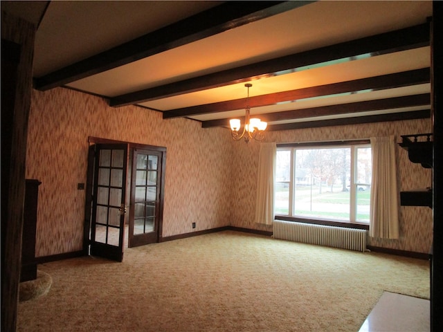 506 W 5th St, Pana, IL 62557 - unfurnished room featuring radiator heating unit, beam ceiling, wallpapered walls, a chandelier, and carpet floors