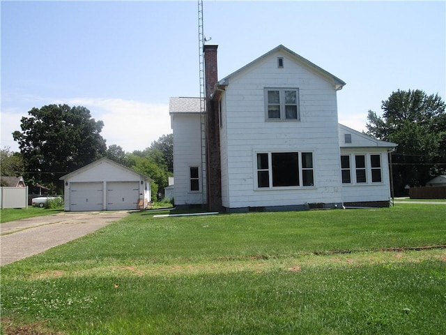 506 W 5th St, Pana, IL 62557 - view of front of house with a chimney, a front lawn, and a detached garage