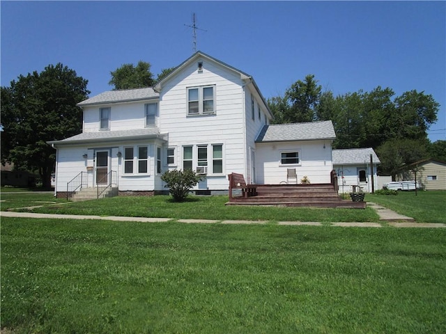 506 W 5th St, Pana, IL 62557 - view of front of house featuring a front lawn and a shingled roof