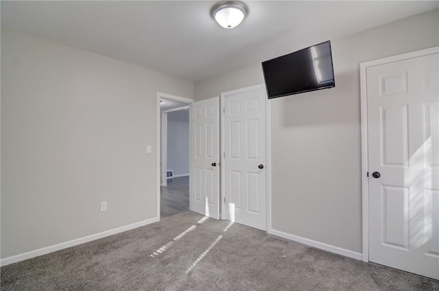 unfurnished bedroom with carpet floors