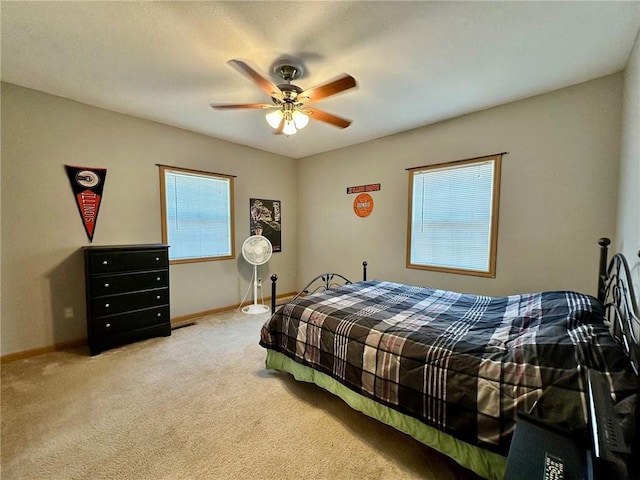 1220 Dewitt Ave, Mattoon, IL 61938 - bedroom with carpet, baseboards, and ceiling fan