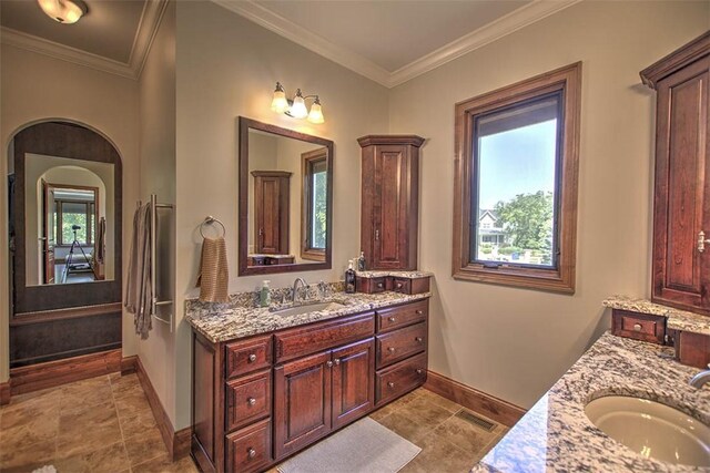 2125 Reserve Way, Decatur, IL 62521 - bathroom with baseboards, two vanities, ornamental molding, and tile patterned floors