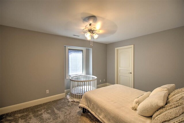 2125 Reserve Way, Decatur, IL 62521 - bedroom with baseboards, dark carpet, and ceiling fan