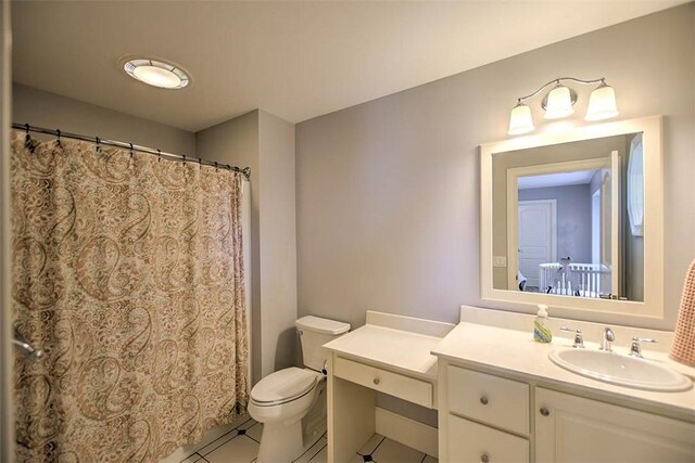 2125 Reserve Way, Decatur, IL 62521 - bathroom with tile patterned floors, vanity, toilet, and a shower with shower curtain