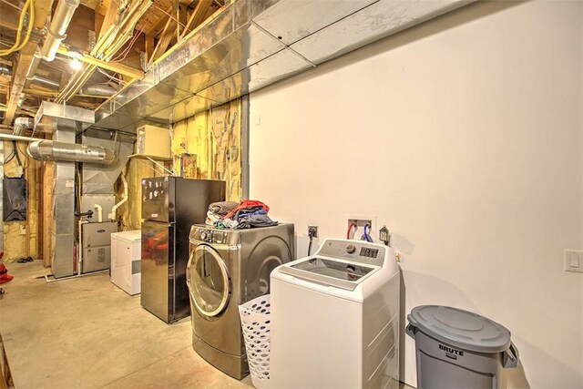 2125 Reserve Way, Decatur, IL 62521 - washroom featuring washing machine and dryer and heating unit