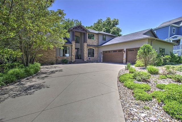 2125 Reserve Way, Decatur, IL 62521 - craftsman-style house featuring an attached garage, driveway, and stone siding