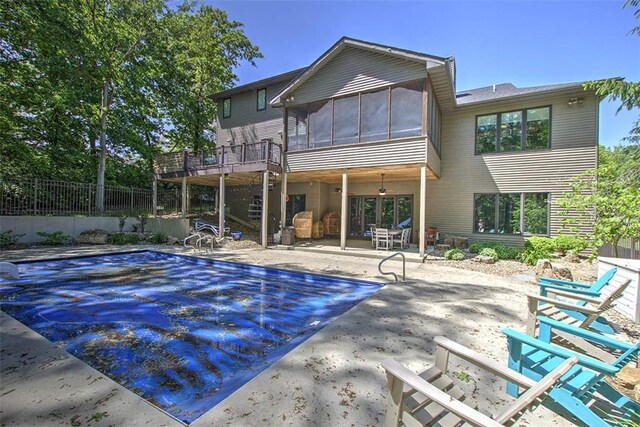 2125 Reserve Way, Decatur, IL 62521 - rear view of house featuring a patio and a sunroom