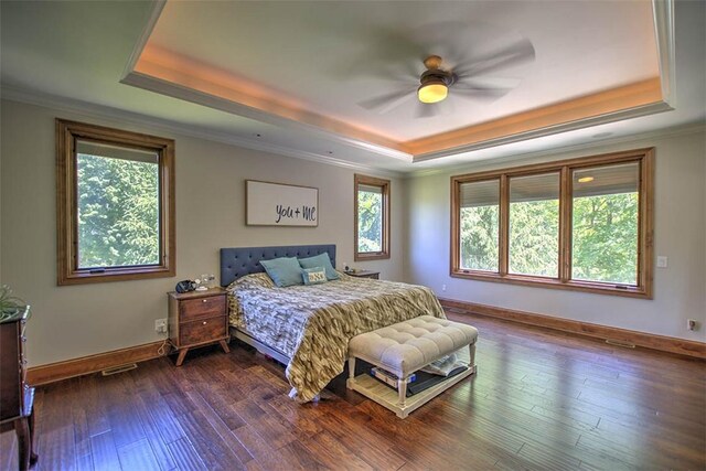 2125 Reserve Way, Decatur, IL 62521 - bedroom with a raised ceiling, ornamental molding, baseboards, dark wood finished floors, and ceiling fan