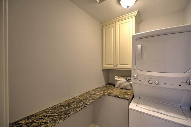 2125 Reserve Way, Decatur, IL 62521 - laundry room with stacked washing machine and dryer and cabinet space