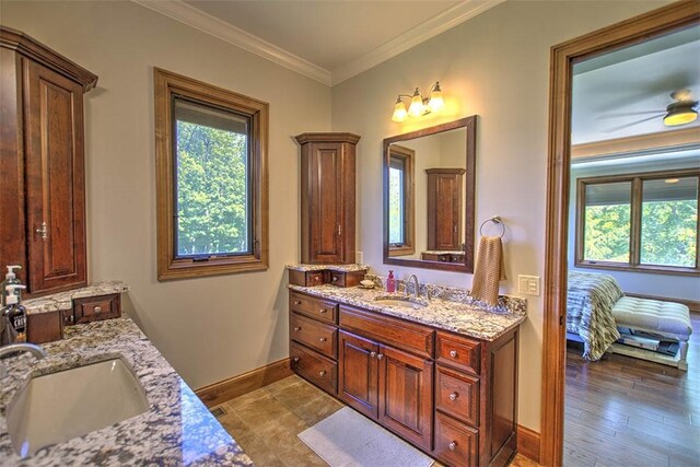 2125 Reserve Way, Decatur, IL 62521 - full bath with baseboards, two vanities, and ornamental molding