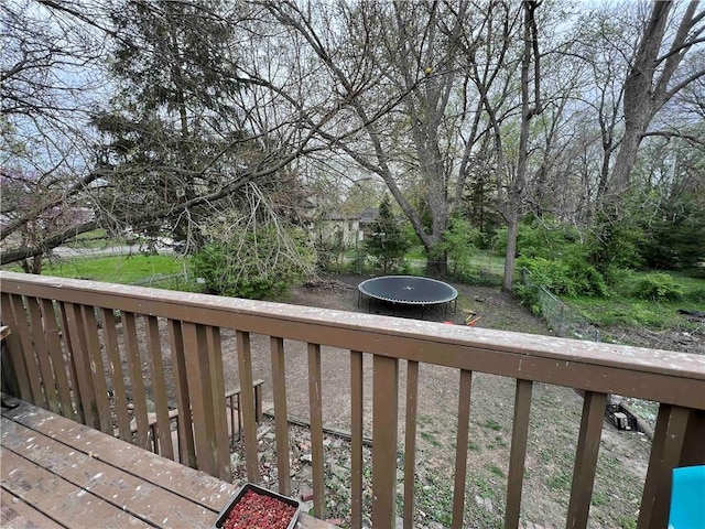 wooden terrace featuring a trampoline
