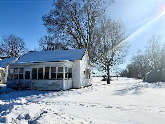 view of front of property with a sunroom