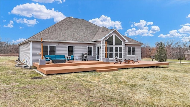 back of property with a wooden deck, an outdoor hangout area, and a yard