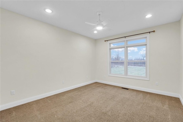 empty room with light carpet and ceiling fan