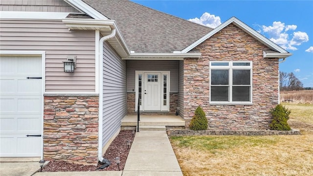 doorway to property featuring a garage