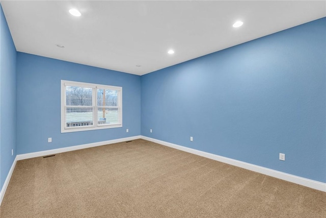 empty room featuring carpet flooring