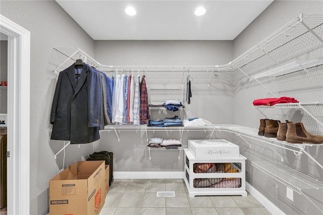 spacious closet featuring tile patterned flooring