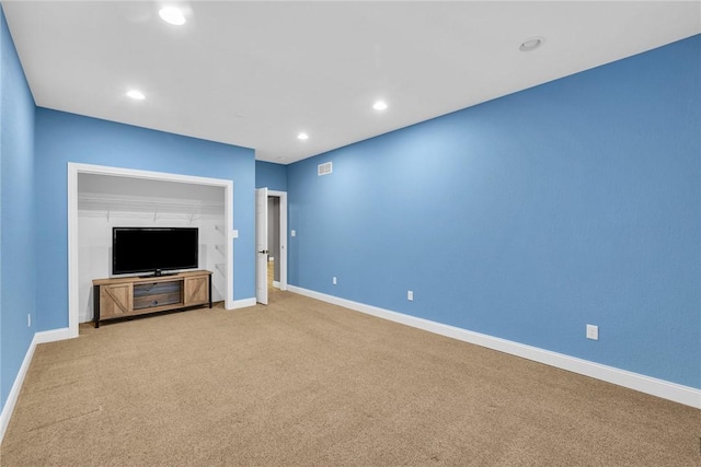 unfurnished living room with carpet floors