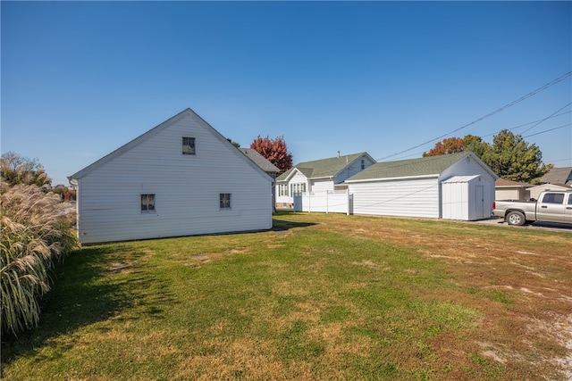 view of side of property with a yard