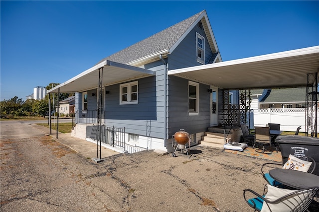 view of front facade with a carport