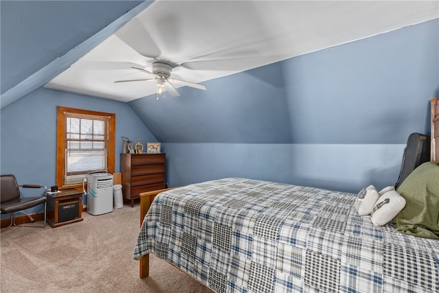 bedroom with ceiling fan, light colored carpet, and lofted ceiling