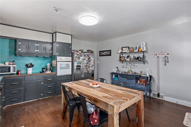 dining area with dark wood-type flooring