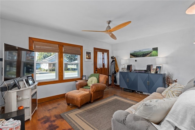 living room featuring dark hardwood / wood-style floors and ceiling fan