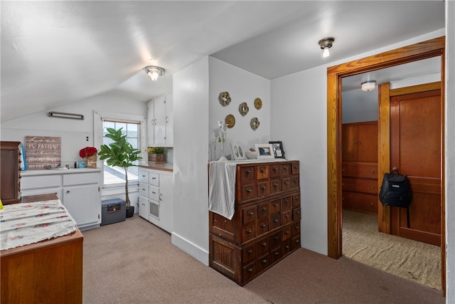 carpeted bedroom featuring vaulted ceiling