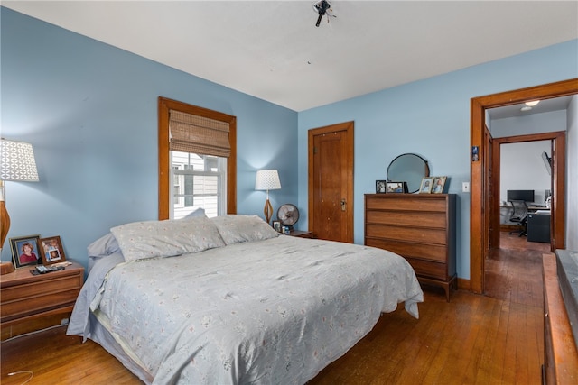 bedroom featuring dark hardwood / wood-style floors