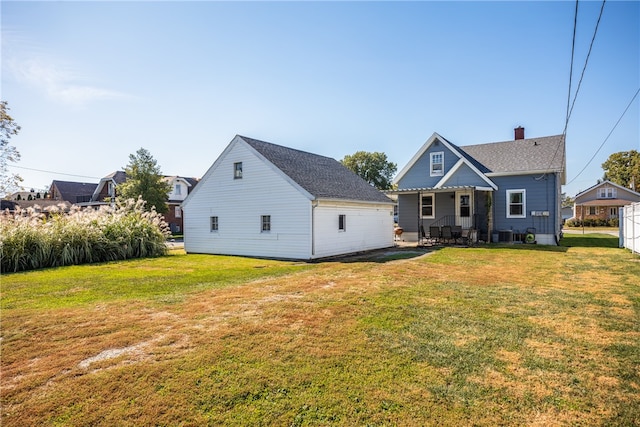 rear view of house with a lawn