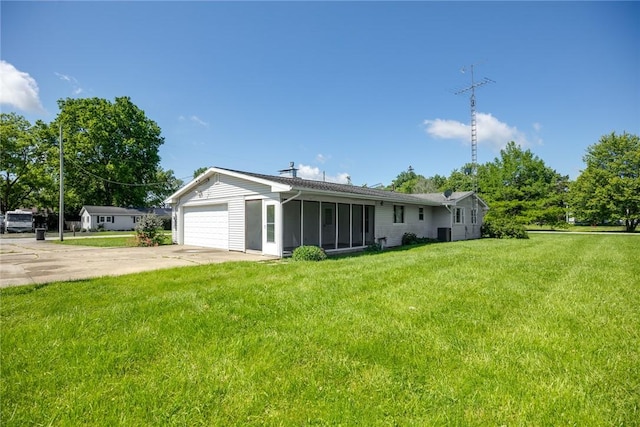 300 Olive St, Watson, IL 62473 - view of front of property featuring a sunroom, driveway, a front yard, and an attached garage