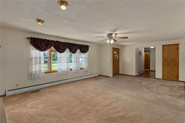 300 Olive St, Watson, IL 62473 - carpeted spare room featuring baseboard heating and ceiling fan