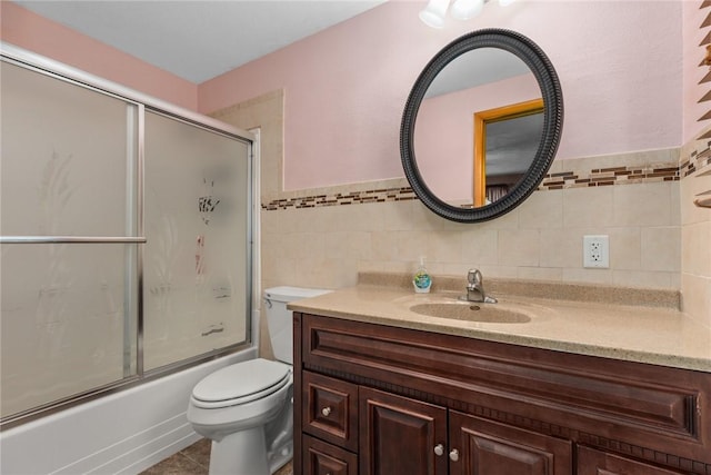 300 Olive St, Watson, IL 62473 - full bath featuring vanity, shower / bath combination with glass door, tile walls, and wainscoting