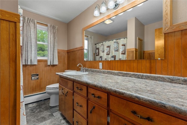 300 Olive St, Watson, IL 62473 - bathroom with a baseboard radiator, a wainscoted wall, vanity, wood walls, and stone finish flooring