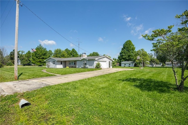 300 Olive St, Watson, IL 62473 - ranch-style house featuring driveway, a front yard, an attached garage, and a chimney