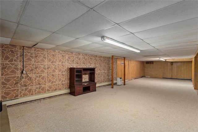 300 Olive St, Watson, IL 62473 - finished below grade area featuring baseboard heating, a drop ceiling, and carpet floors