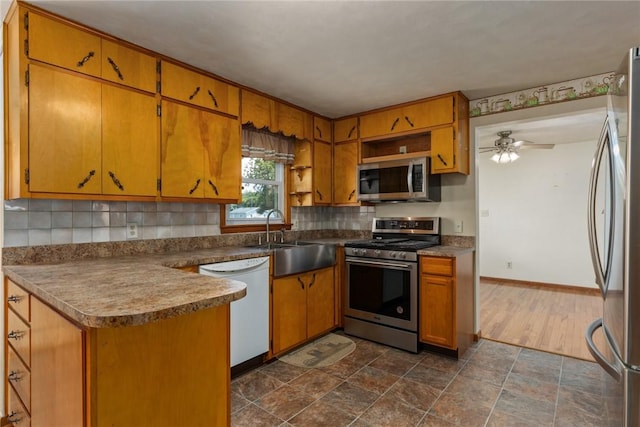 300 Olive St, Watson, IL 62473 - kitchen with appliances with stainless steel finishes, tasteful backsplash, brown cabinets, open shelves, and ceiling fan