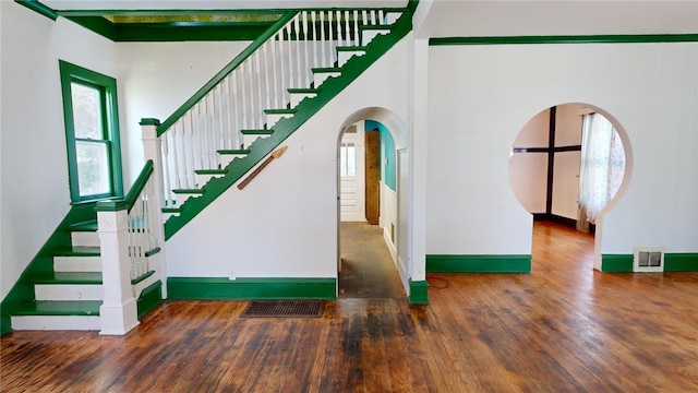 stairway with hardwood / wood-style flooring