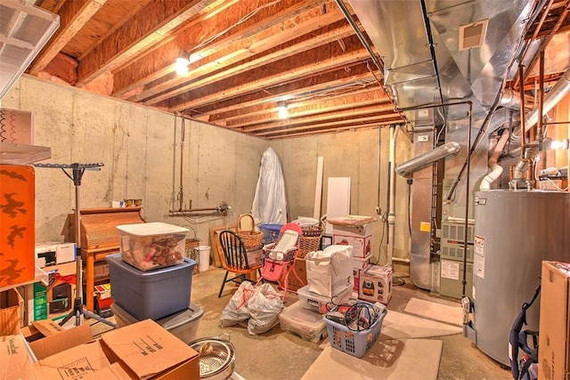 unfinished below grade area with visible vents and water heater