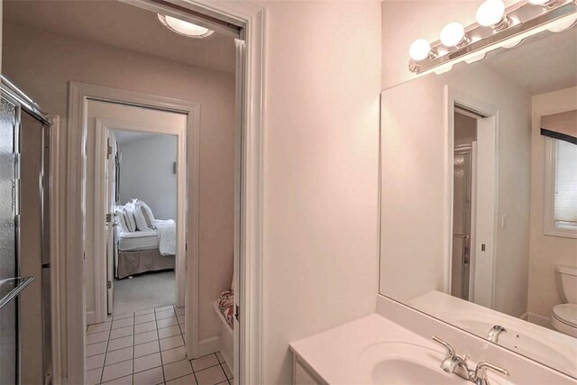 bathroom featuring tile patterned flooring, ensuite bath, vanity, and visible vents