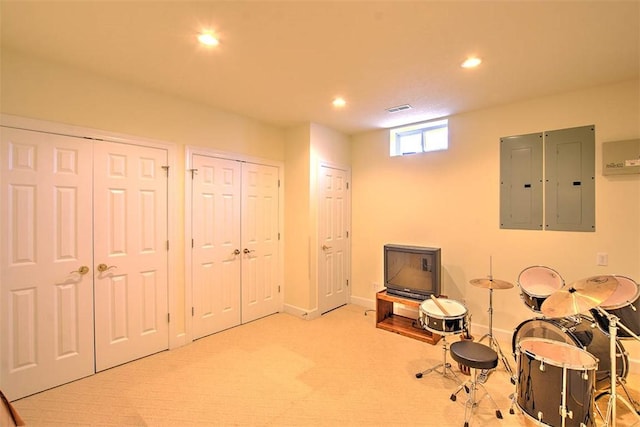 rec room with visible vents, baseboards, carpet, electric panel, and recessed lighting