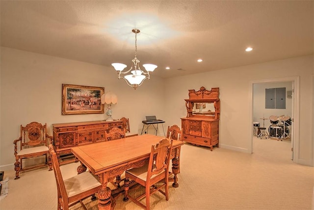 dining space with baseboards, light colored carpet, electric panel, recessed lighting, and an inviting chandelier