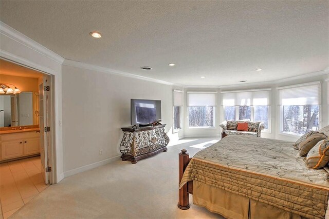 bedroom featuring a textured ceiling, light colored carpet, baseboards, and ornamental molding