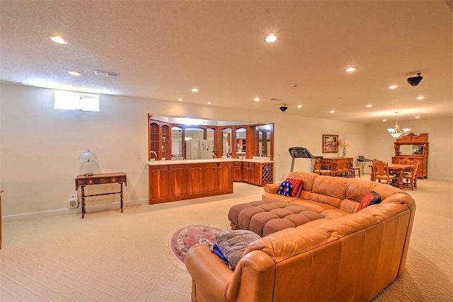 living room featuring recessed lighting, light colored carpet, visible vents, and baseboards