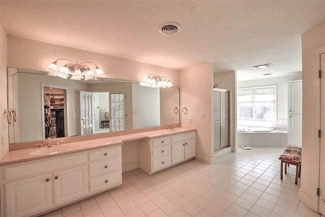 full bath with vanity, visible vents, a stall shower, a garden tub, and tile patterned floors