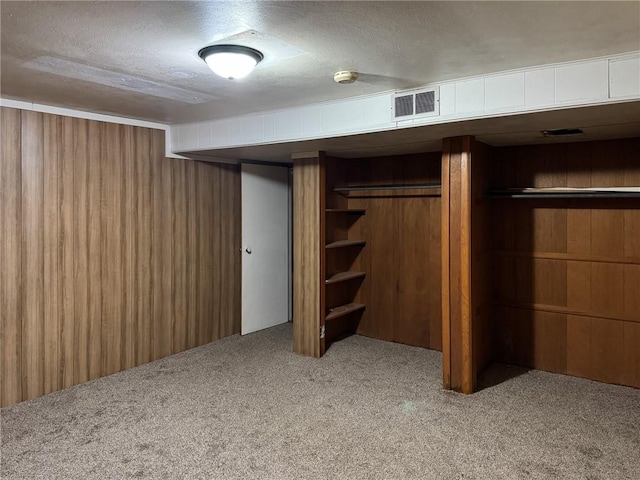 1511 E Fayette Ave, Teutopolis, IL 62467 - finished basement with carpet floors, wooden walls, and a textured ceiling