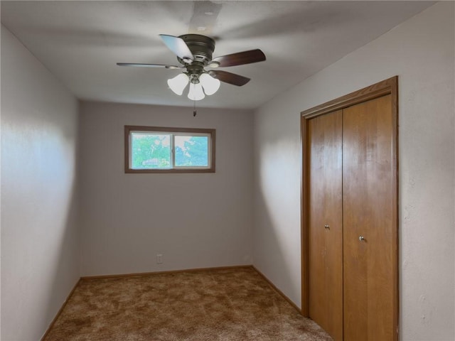 1511 E Fayette Ave, Teutopolis, IL 62467 - unfurnished bedroom with carpet floors, a closet, and a ceiling fan