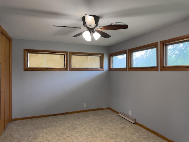 1511 E Fayette Ave, Teutopolis, IL 62467 - spare room with a baseboard radiator and ceiling fan